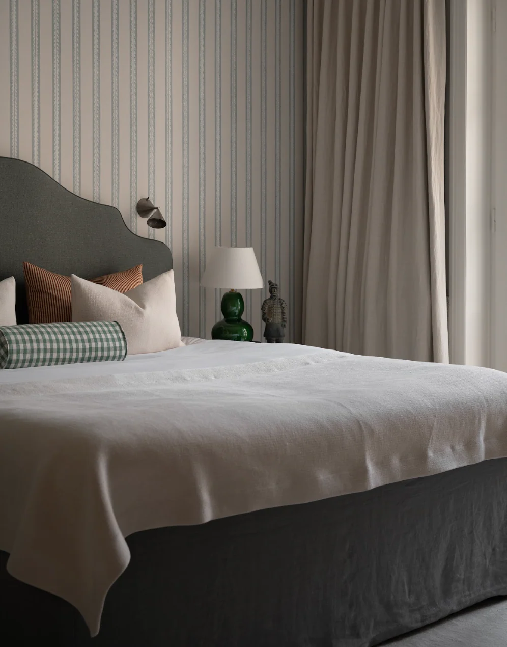 Custom upholstered headboard in a luxury bedroom